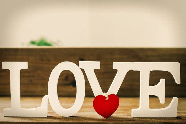 wooden letters with the word love, message and love concept - Foto, afbeelding