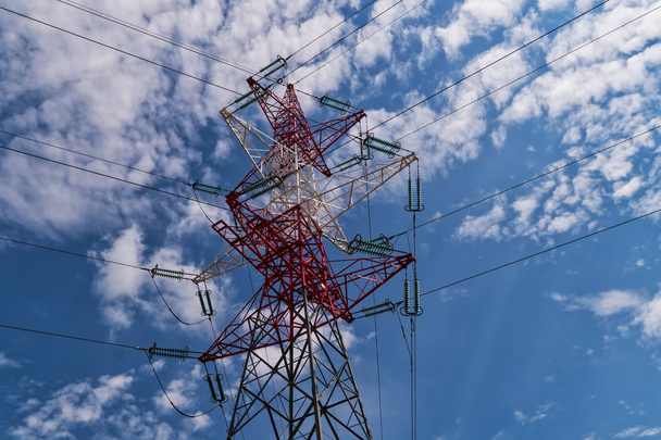 Electricity Pylon, high voltage cable on blue day with clouds - Photo, Image