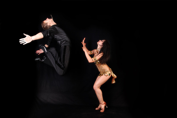 Dancers against black background - Foto, Imagem
