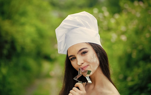 Chief cooker or chef. Woman in chef hat on summer day - Photo, Image