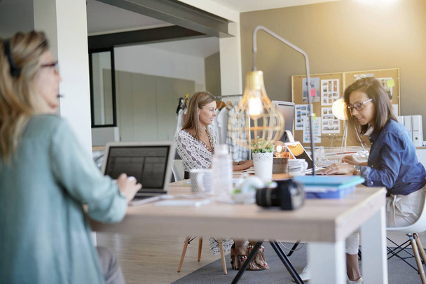 Businesswomen working in co-working space - Photo, image