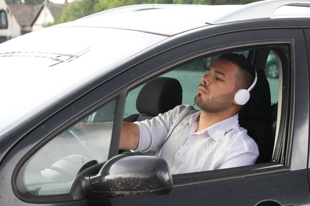 tired driver listening music  - Photo, Image