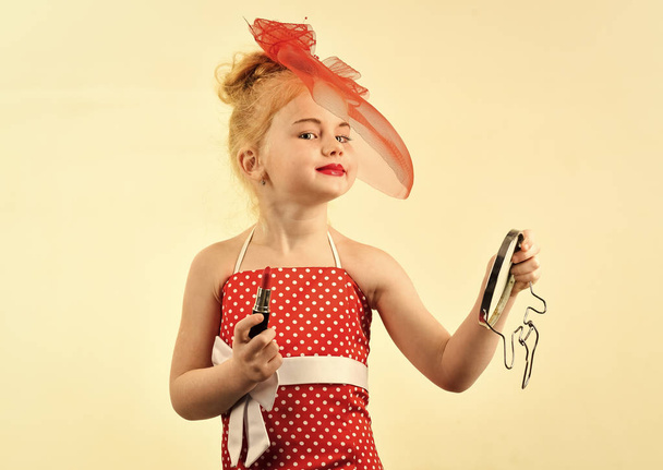 Kids model agency. Makeup retro look and hairdresser. Retro girl fashion with cosmetics, beauty. Fashion and beauty, pinup style, childhood. Child girl in stylish dress, makeup. Little girl hold - Photo, image