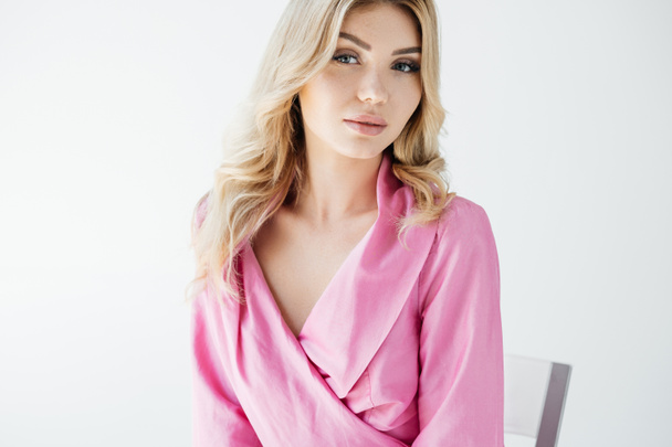 portrait of attractive young woman in pink blouse posing on white background - Φωτογραφία, εικόνα