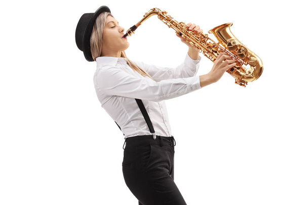 Female jazz musician playing a saxophone isolated on white background - 写真・画像
