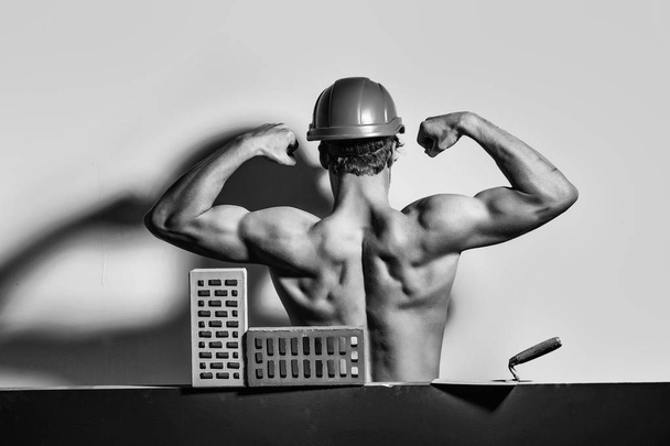 building materials. Handyman. sexy muscular man builder - 写真・画像