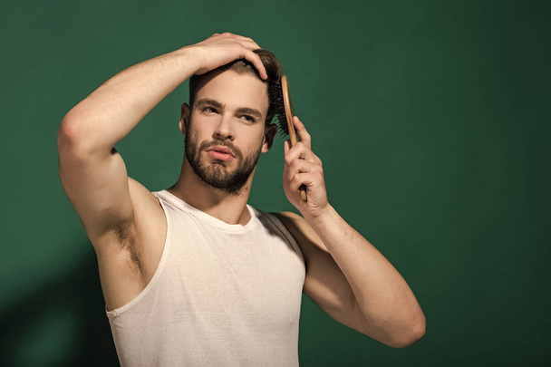 Glamur man hair style. Macho with bearded face and haircut in white singlet - Photo, image