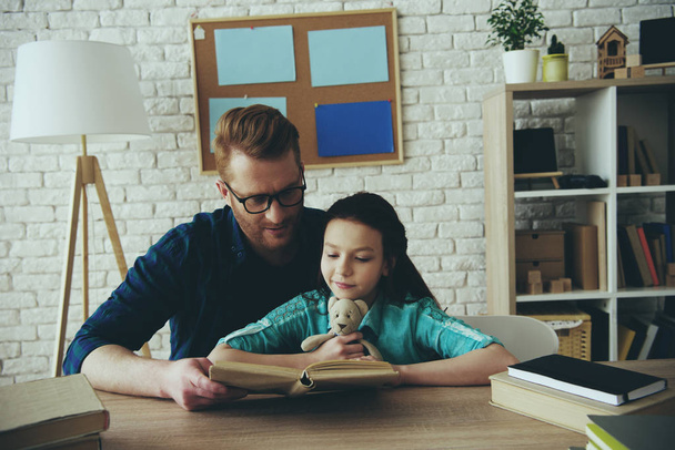 Red haired father in glasses reads fairy tale - Photo, image