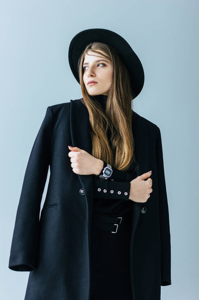 Young caucasian woman with black coat and hat - Foto, Imagem