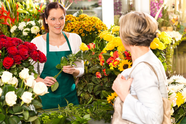 Young woman arranging flowers shop market selling - Photo, Image