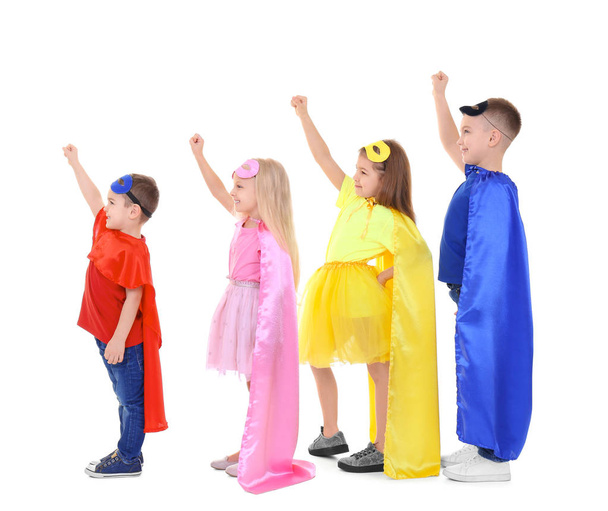 Cute children in superhero costumes on white background - Photo, Image