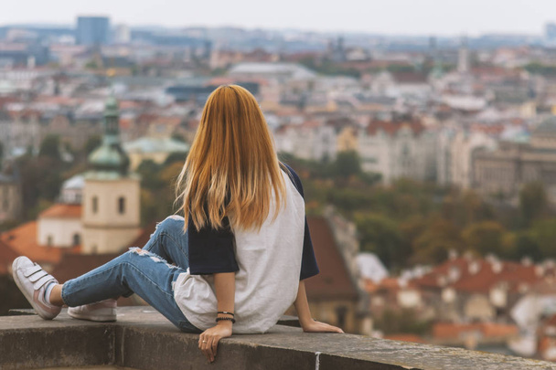 Woman enjoying the view of the city on an autumn day - Photo, image