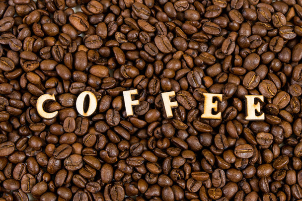 La parola caffè su sfondo chicchi di caffè
 - Foto, immagini