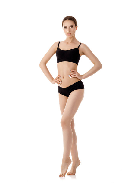 woman with perfect sporty body in black lingerie - Fotó, kép