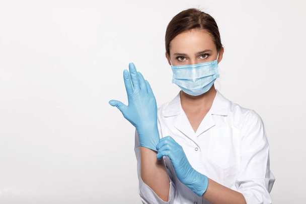 doctor wearing mask and gloves - Fotó, kép