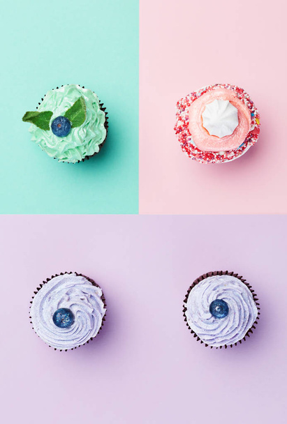 Dessert. Cupcakes On Colorful Background. Close Up Of Mini Cakes With Pastel Color Cream. High Resolution - Foto, afbeelding