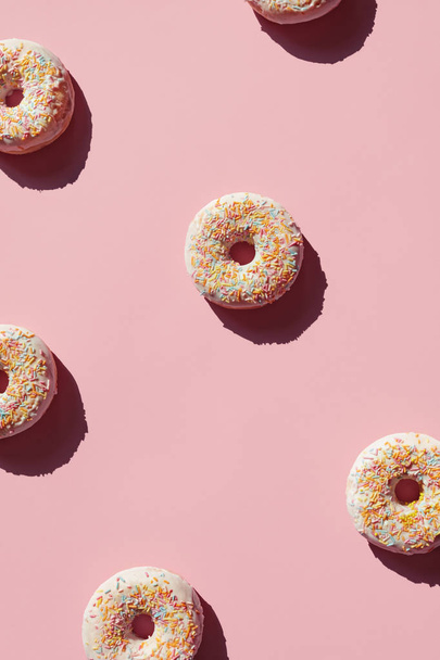Donuts On Pink Background. Close Up Of Sweet Pastry Dessert With Sprinkles And Glaze. High Resolution - Photo, Image