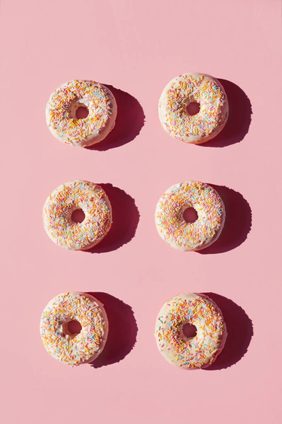 Donuts On Pink Background. Close Up Of Sweet Pastry Dessert With Sprinkles And Glaze. High Resolution - Photo, Image