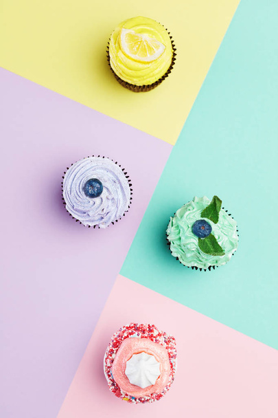 Cake. Colorful Cupcakes Close Up. Variety Of Sweet Desserts On Pastel Colors Background. High Resolution - 写真・画像