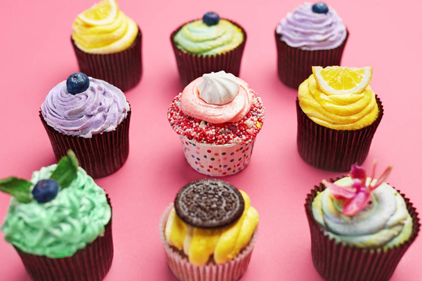 Colorful Cupcakes On Pink Background. Cake Desserts With Cream And Different Toppings. High Resolution - Photo, Image