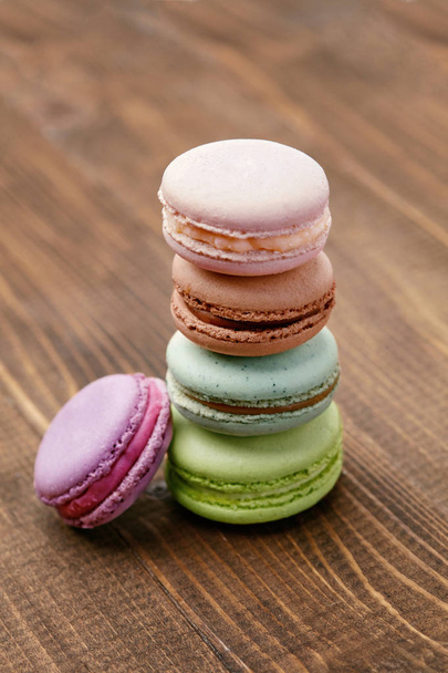 Chocolate Macarons On Wooden Table. Close Up French Macaroons Still Life. High Resolution - Photo, Image