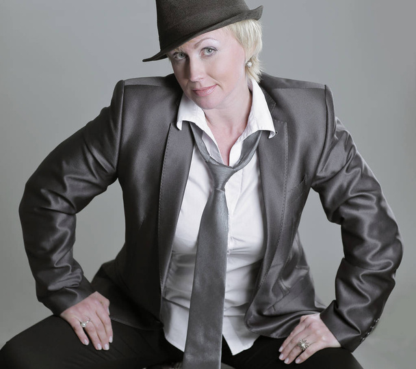glamorous woman in a pantsuit .isolated on gray background. - Foto, immagini