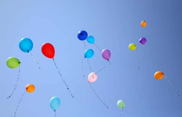 Colorful balloons on a blue sky background - Photo, Image