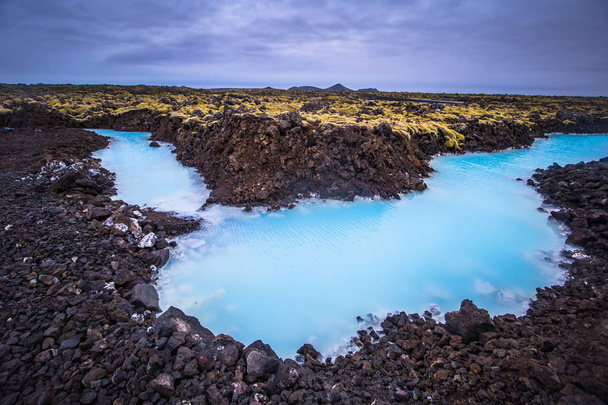 Blue Lagoon - May 09, 2018: Volcanic terrain at the Blue Lagoon thermal water spa, Iceland - Foto, Bild