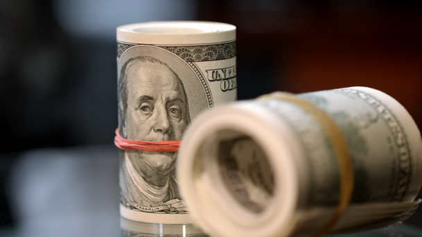Cash money rolls on table. Rotating rolls of hundred american dollar bills - Footage, Video