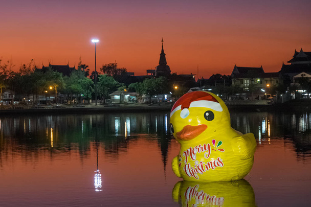 Giant rubber duck with "Happy New Year" in Thai language in it's chest floating in Nongharn Lake in Udonthani provinve, Thailand - Photo, Image