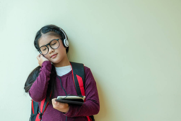 cute girl enjoys listens to music in headphones in home, children concept, education concept - Fotografie, Obrázek