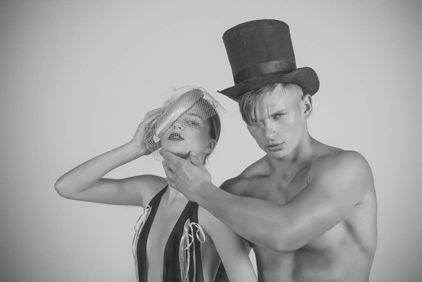 circus show. Couple in love posing on grey background - Foto, imagen