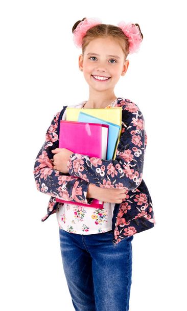 Portrait of smiling happy school girl child with books isolated on a white background education concept - Foto, Bild