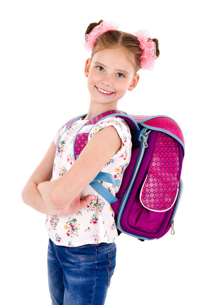 Retrato de niña feliz sonriente de la escuela con la mochila del bolso de la escuela y los libros aislados en un concepto de educación de fondo blanco
 - Foto, imagen