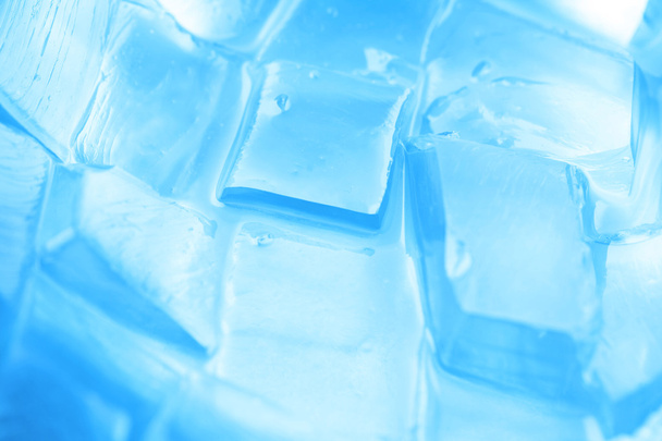 background with ice cubes in blue light - 写真・画像