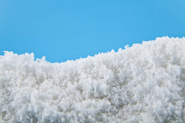 white snow on a blue background - Фото, зображення
