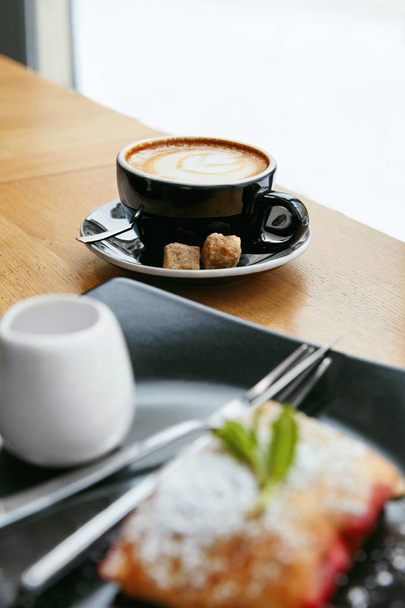 Cup Of Coffee And Tasty Dessert In Cafe. Fresh Hot Drink With Bakery On Wooden Table. High Resolution. - Fotó, kép