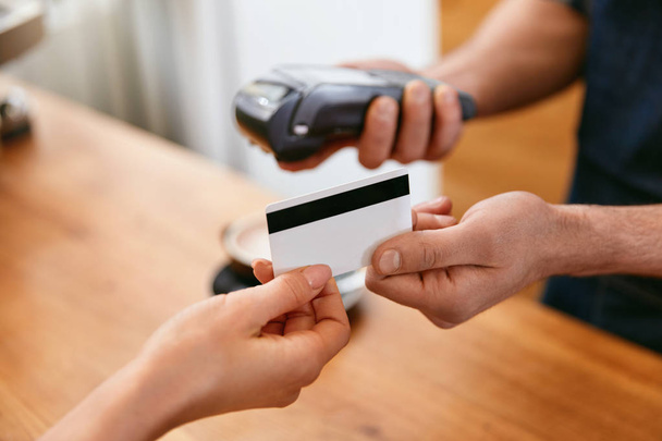 Customer Paying With Credit Card In Coffee Shop Closeup. High Resolution. - Φωτογραφία, εικόνα