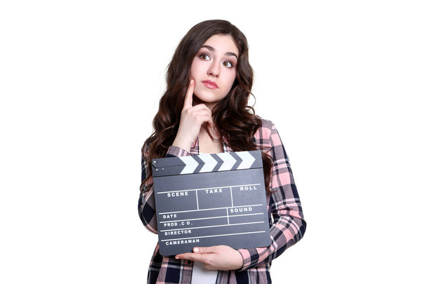 Young woman with clapper board on white background - Fotoğraf, Görsel