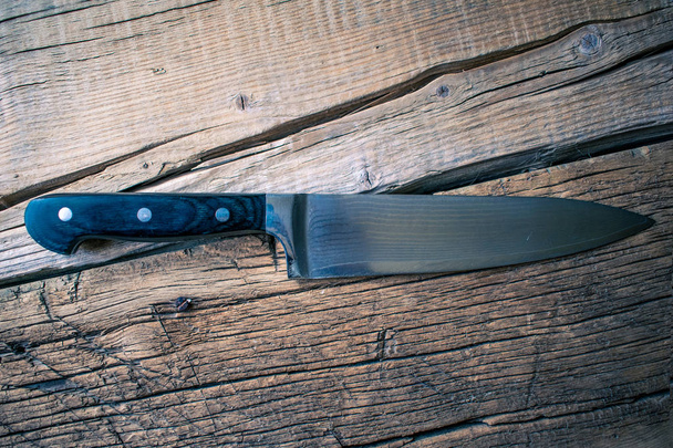 Table knife on the board. - 写真・画像