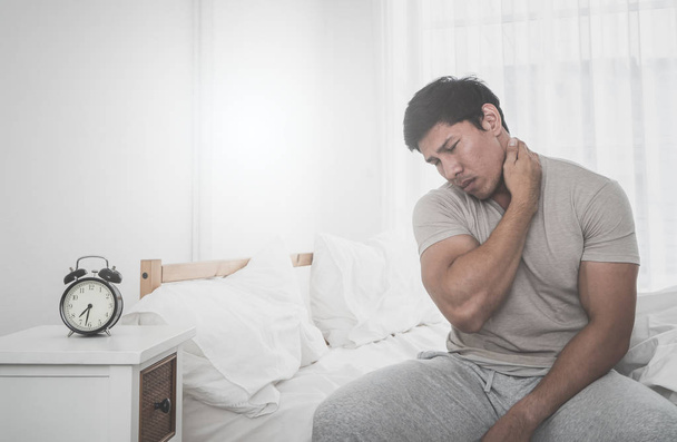Male woke up having neck pain from sleeping - Photo, Image