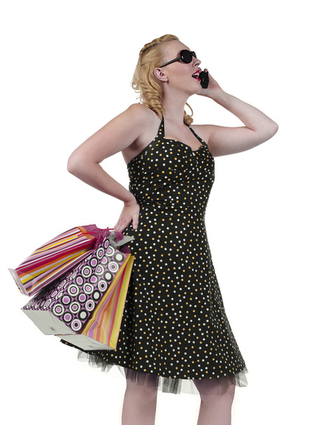 beautiful woman with shopping bags talking on cellphone - Foto, Imagen