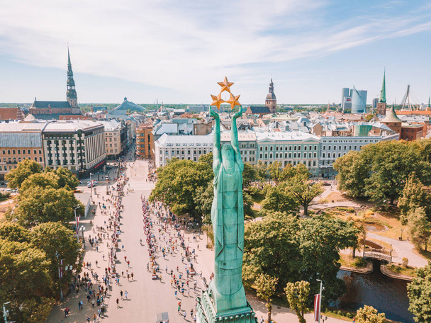May 20, 2018. Riga, Latvia. Aerial view of the statue of liberty Milda in the center of Riga during international Lattelecom marathon. - Фото, изображение