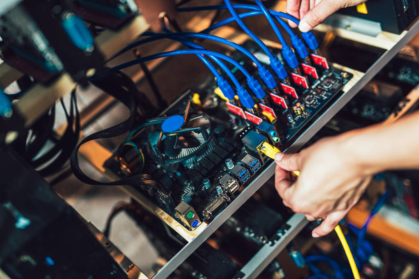 Cropped view of programmer configuring hardware for successful bitcoin mining - Fotoğraf, Görsel