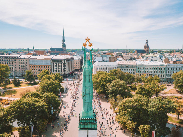 May 20, 2018. Riga, Latvia. Aerial view of the statue of liberty Milda in the center of Riga during international Lattelecom marathon. - Фото, изображение