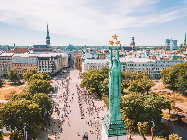 May 20, 2018. Riga, Latvia. Aerial view of the statue of liberty Milda in the center of Riga during international Lattelecom marathon. - Zdjęcie, obraz
