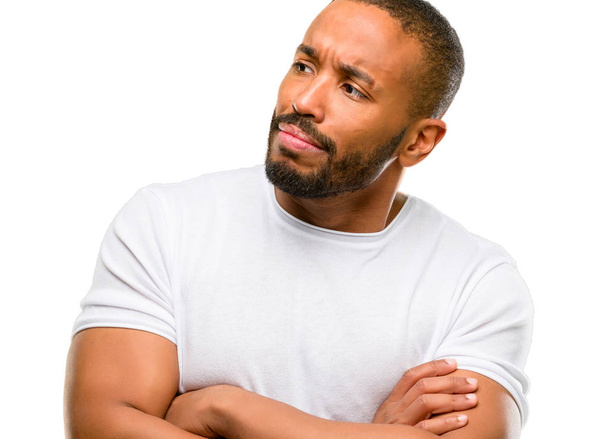 African american man with beard with crossed arms confident and happy with a big natural smile laughing isolated over white background - Foto, Imagem