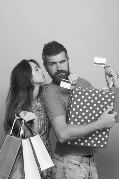 Couple in love hugs holding big box and shopping bags - Valokuva, kuva