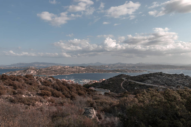 View from the Italian island of La Maddalena to Palau on the Italian island of Sardinia with boats and ferries sailing back and forth between the islands - Photo, Image