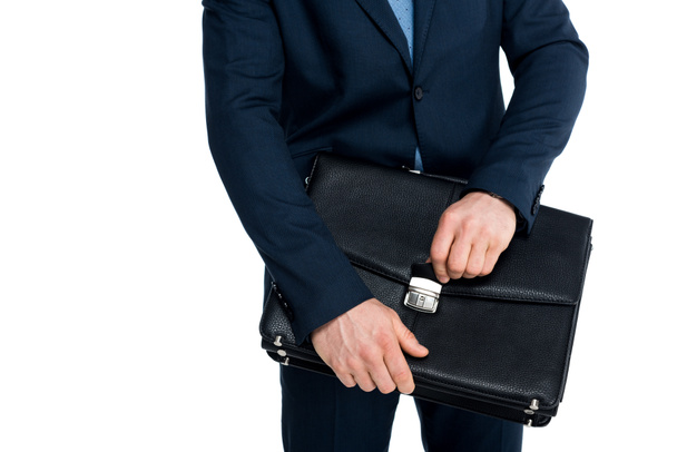 mid section of businessman in formal wear holding briefcase isolated on white - 写真・画像